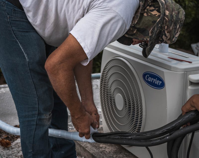an HVAC technician doing his job